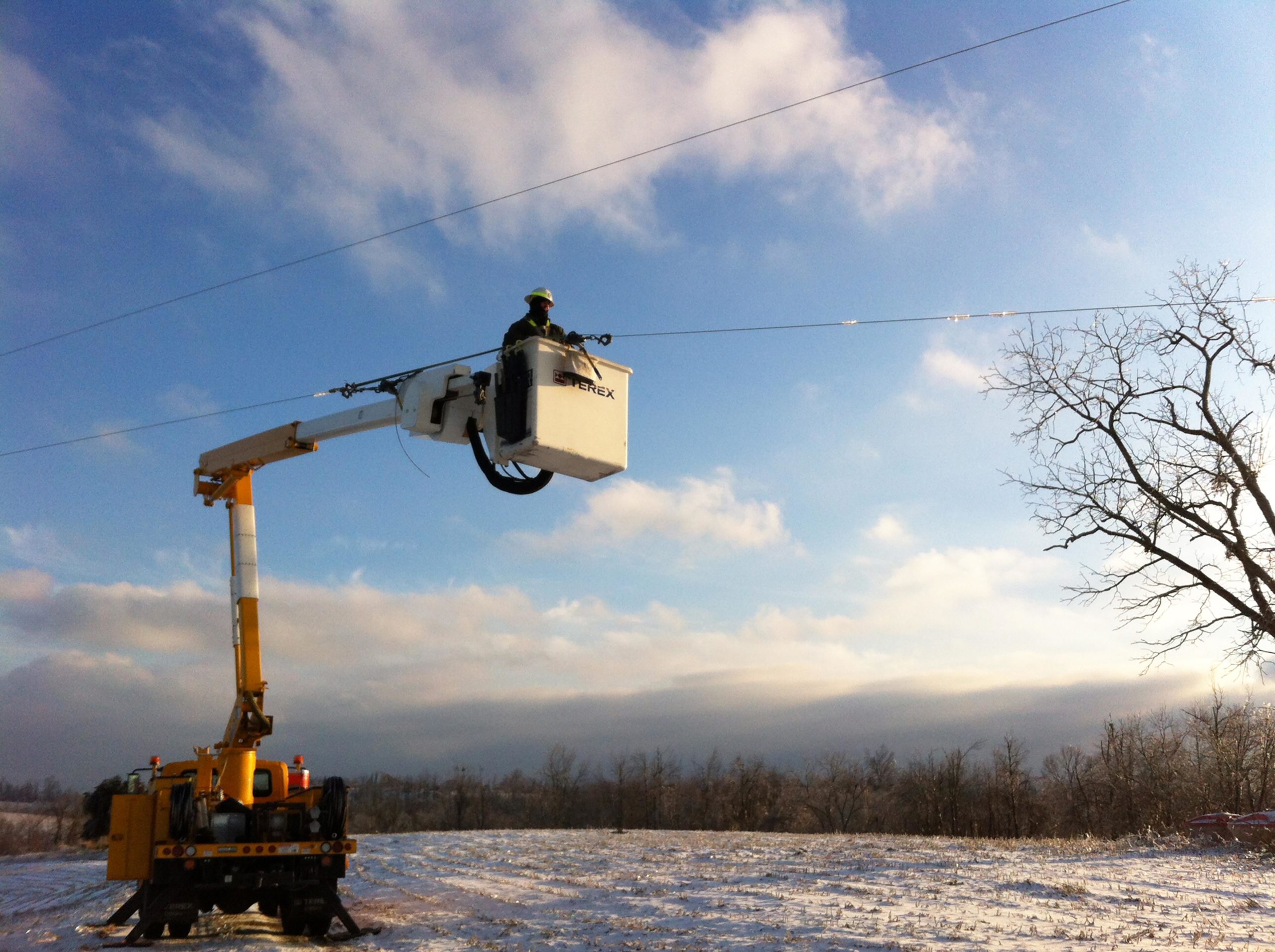 appalachian electric bucket truck in the snow