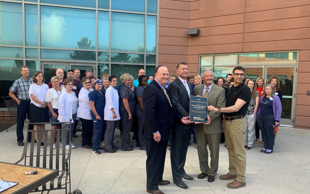 representatives from first horizon bank and tennova jefferson memorial hospital posing with the chamber of commerce jefferson countains of the year award, awarded to tennova jefferson memorial and sponsored by first horizon
